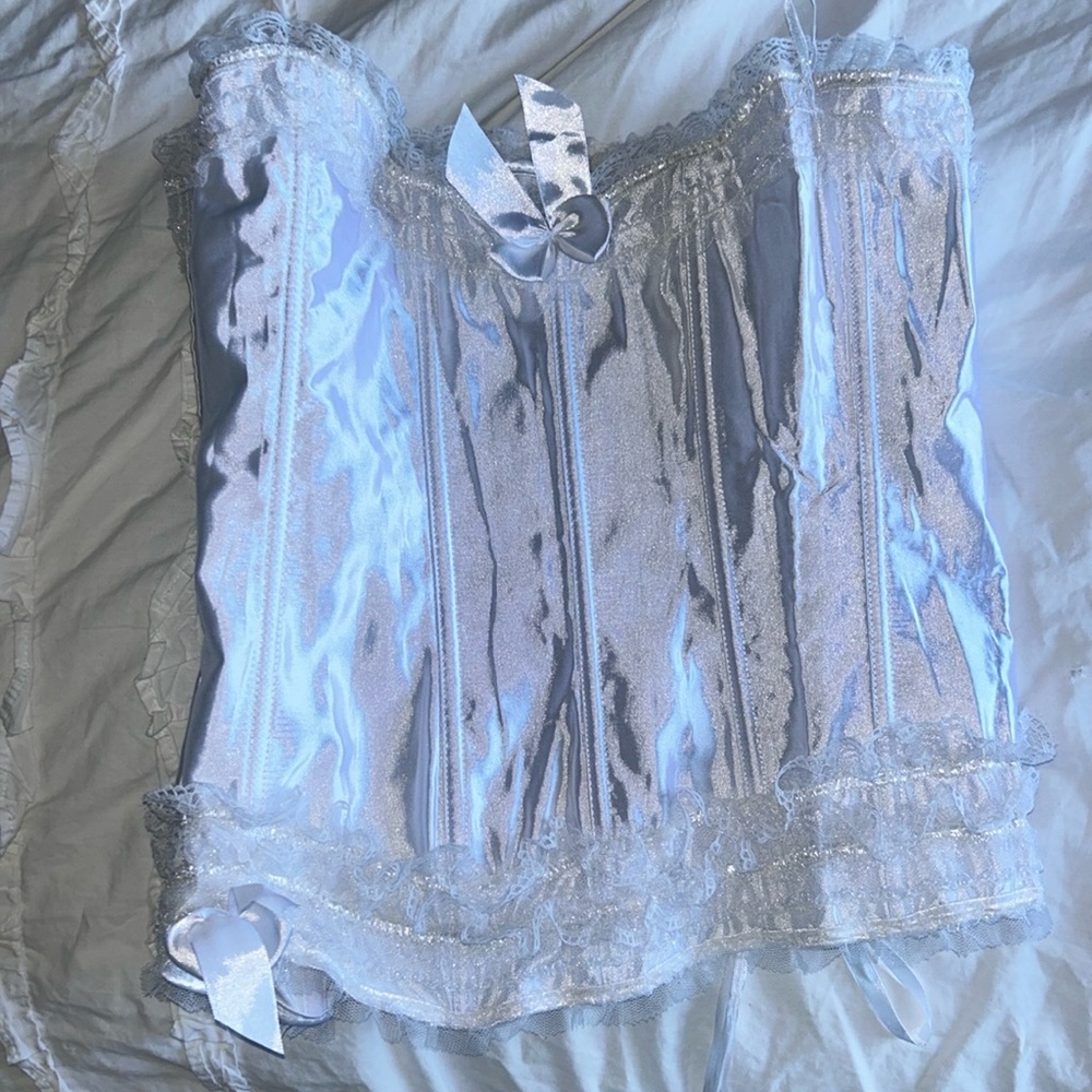 White satin corset top with tie in back and zipper on side
